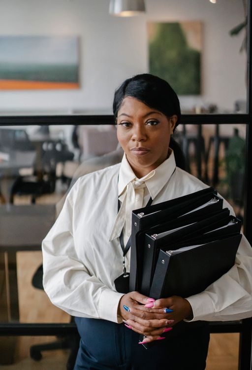 A professional carrying organized document folders